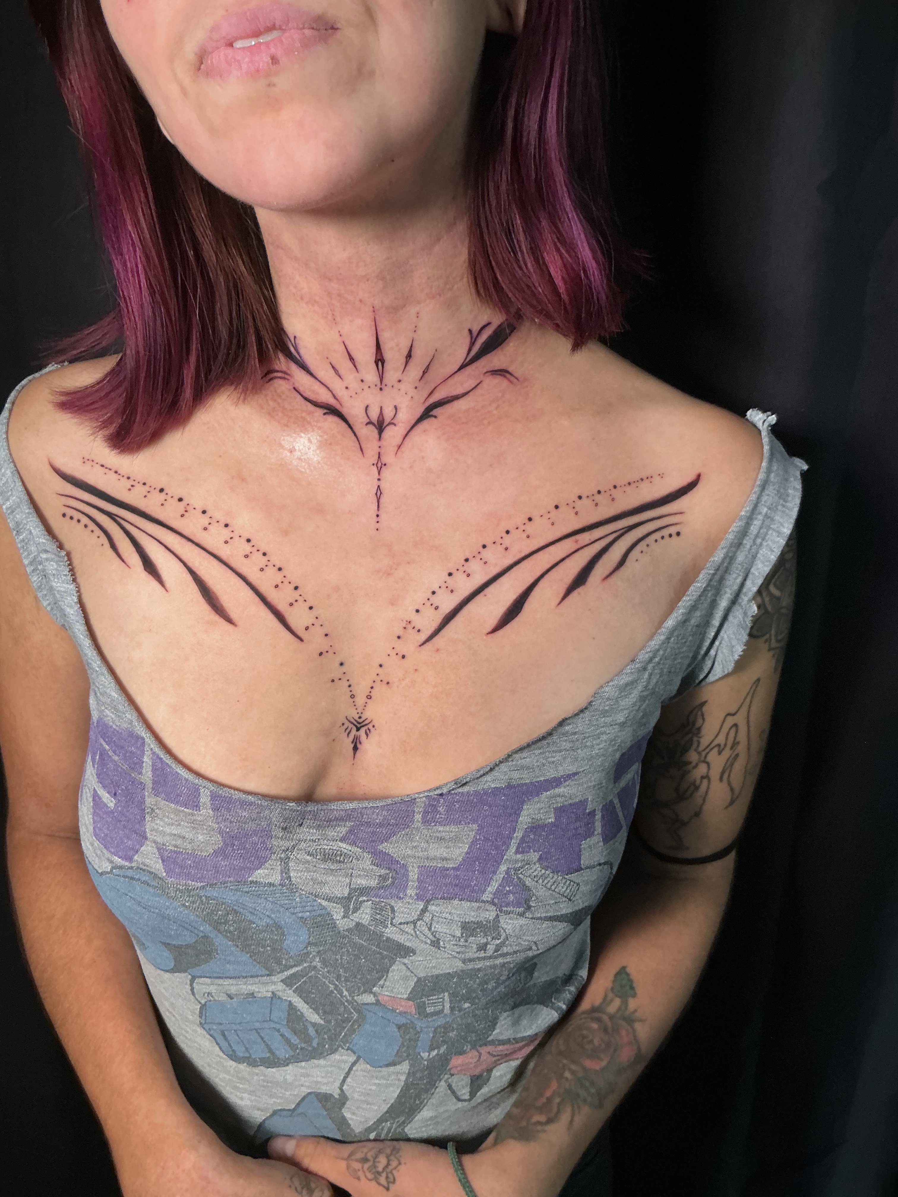 Black and grey chest tattoo