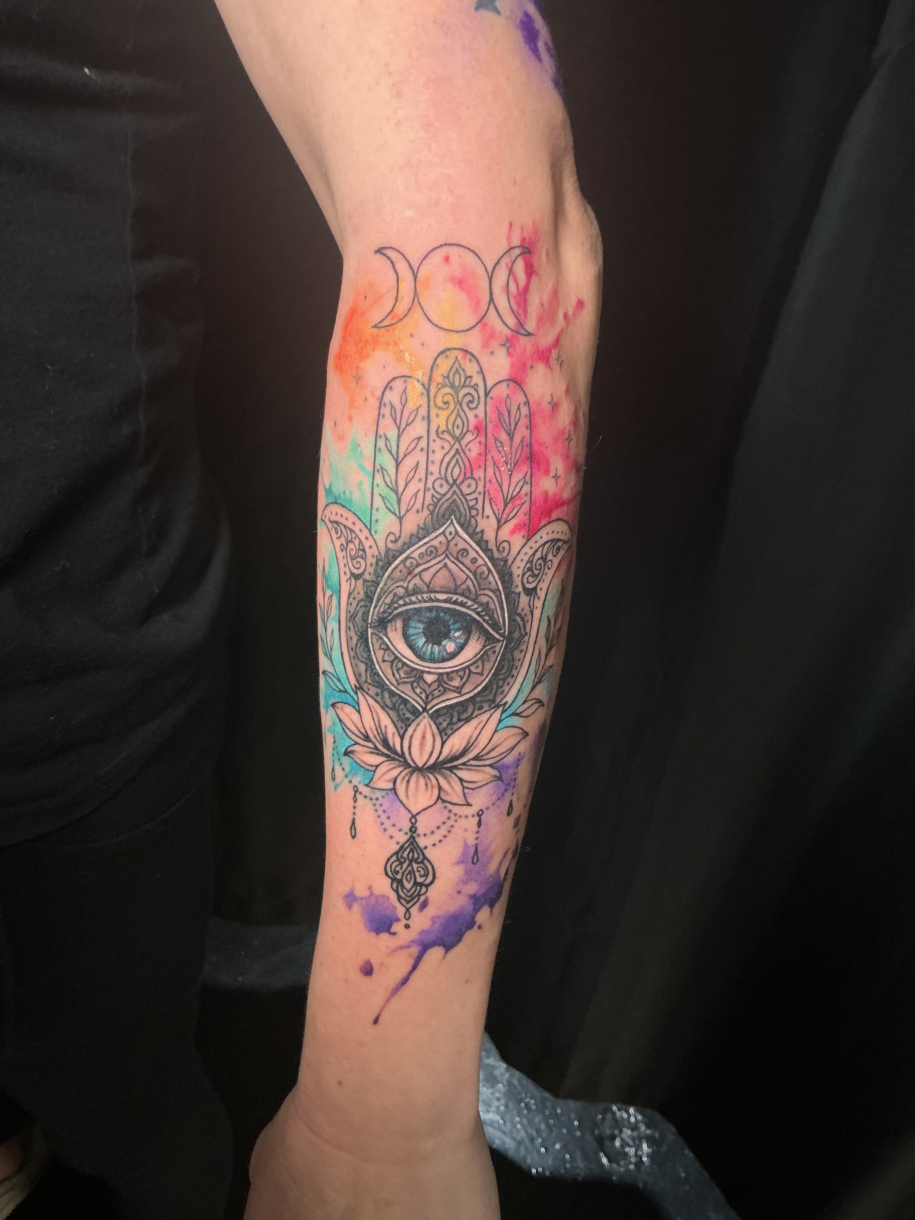 Large red and black sleeve tattoo