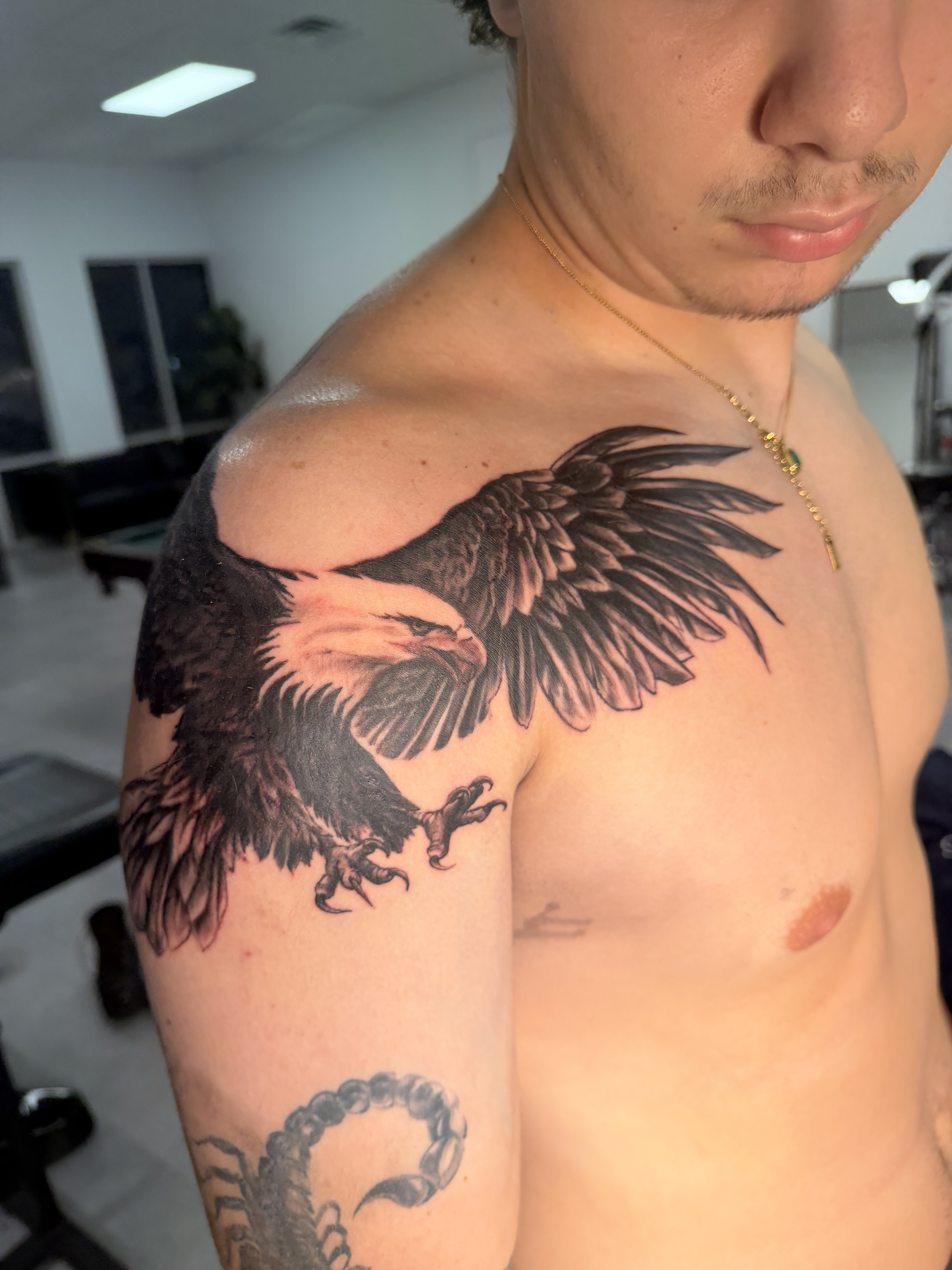 Black and grey illustrative tattoo
