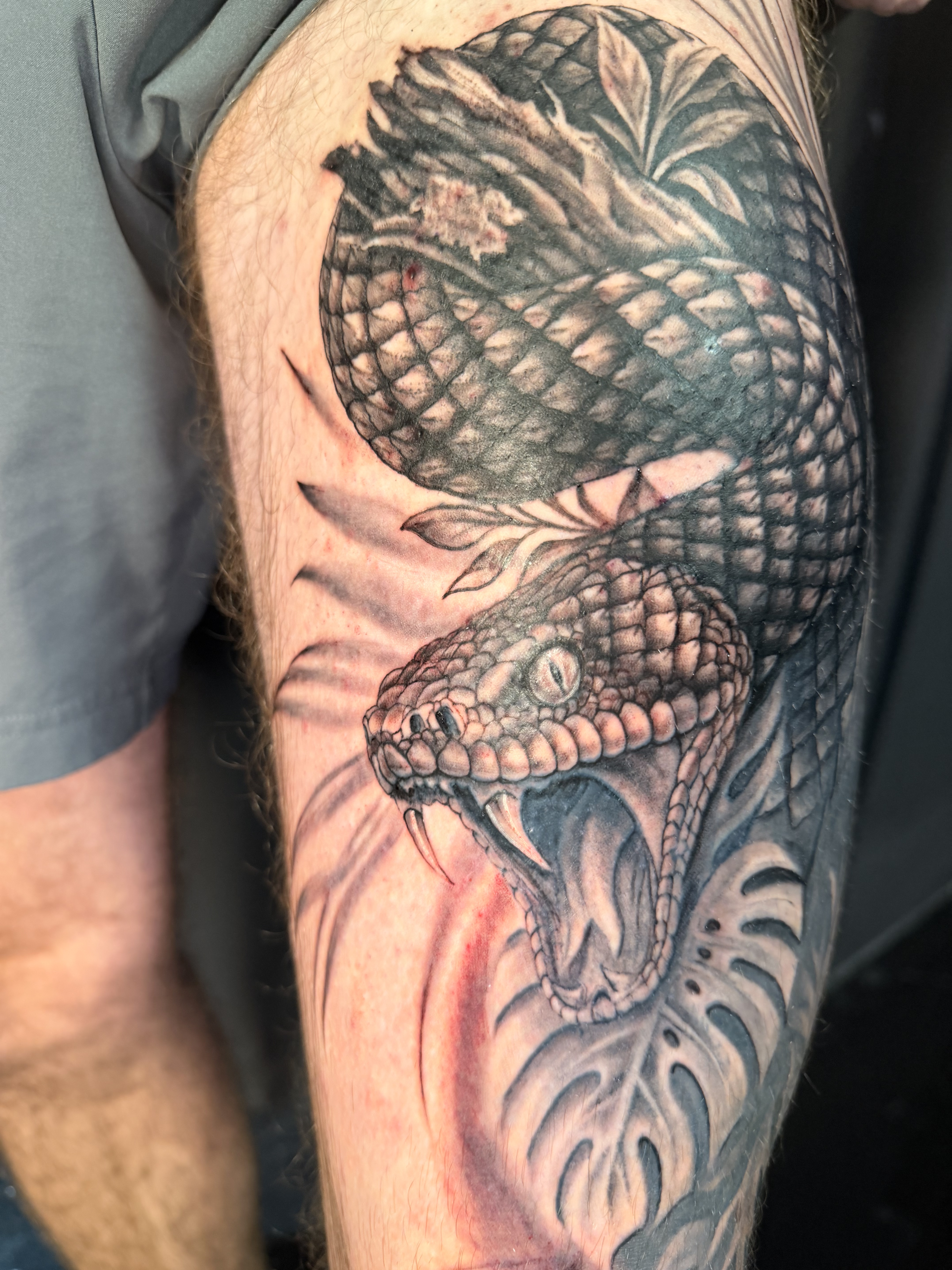 Fine line floral forearm tattoo