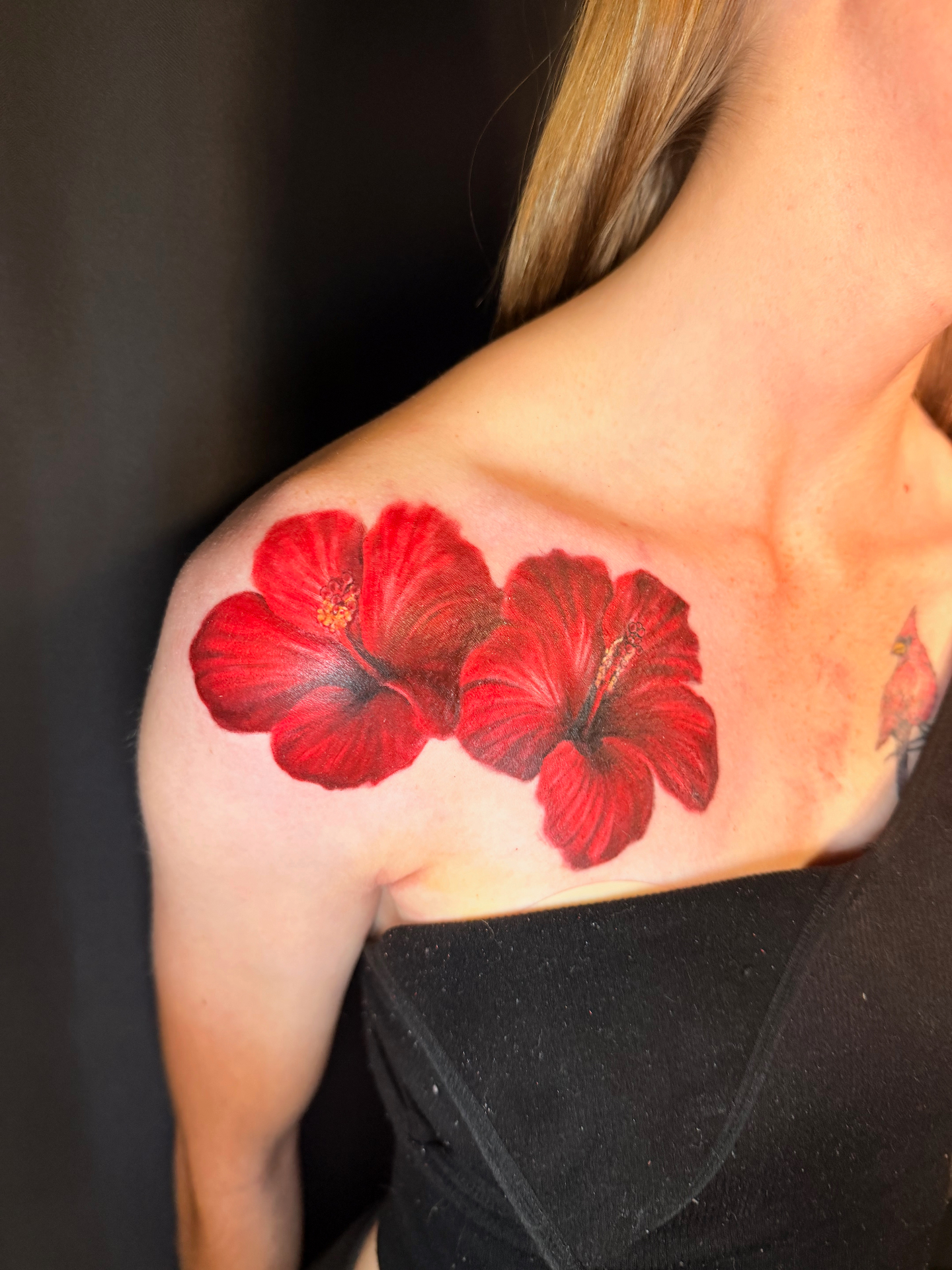 Realistic red hibiscus shoulder tattoo pair