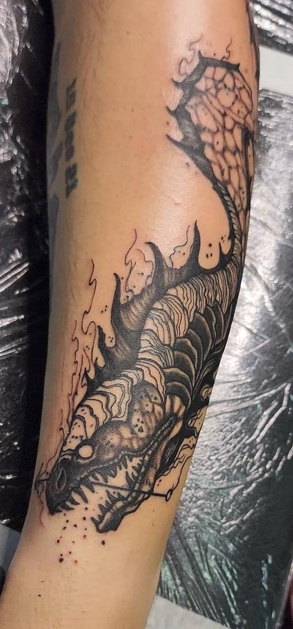 Black and grey dragon head detail, sleeve tattoo