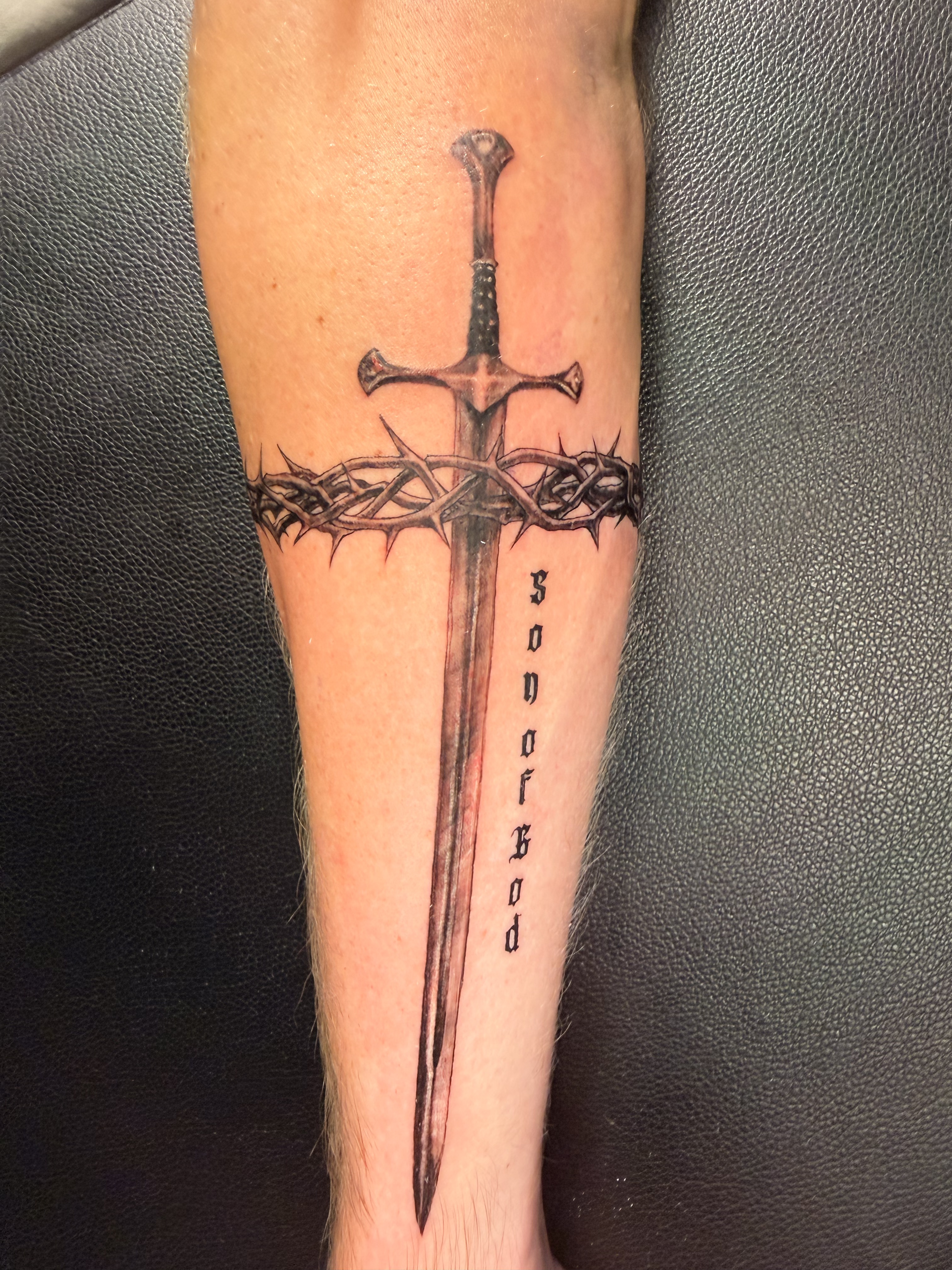 Black and grey hand tattoo