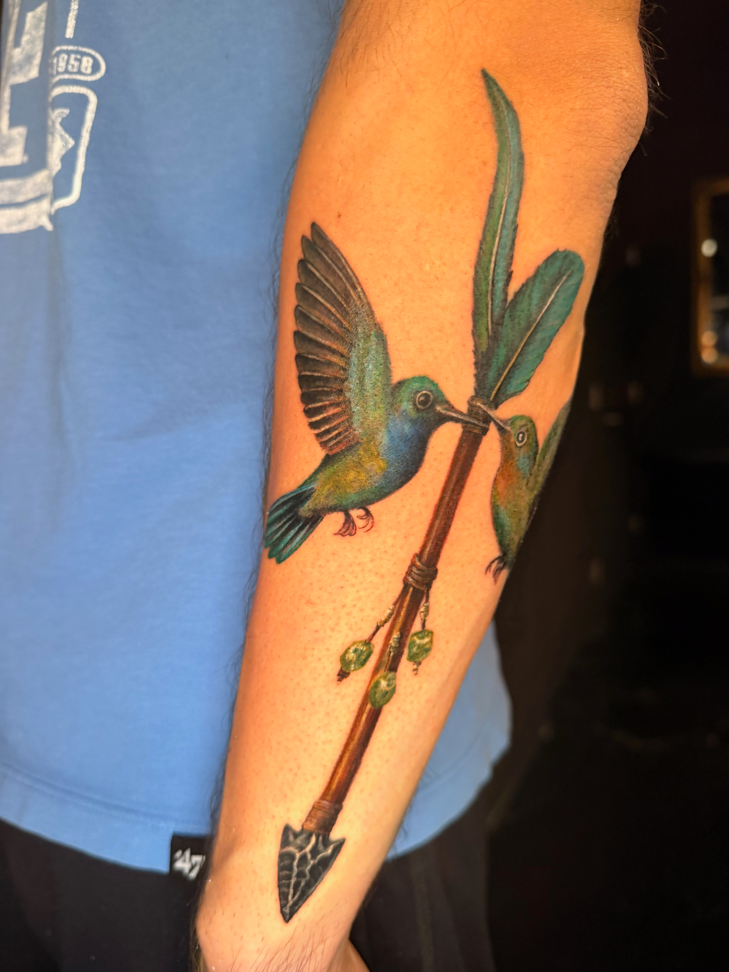 Color realism hummingbirds with arrow forearm tattoo