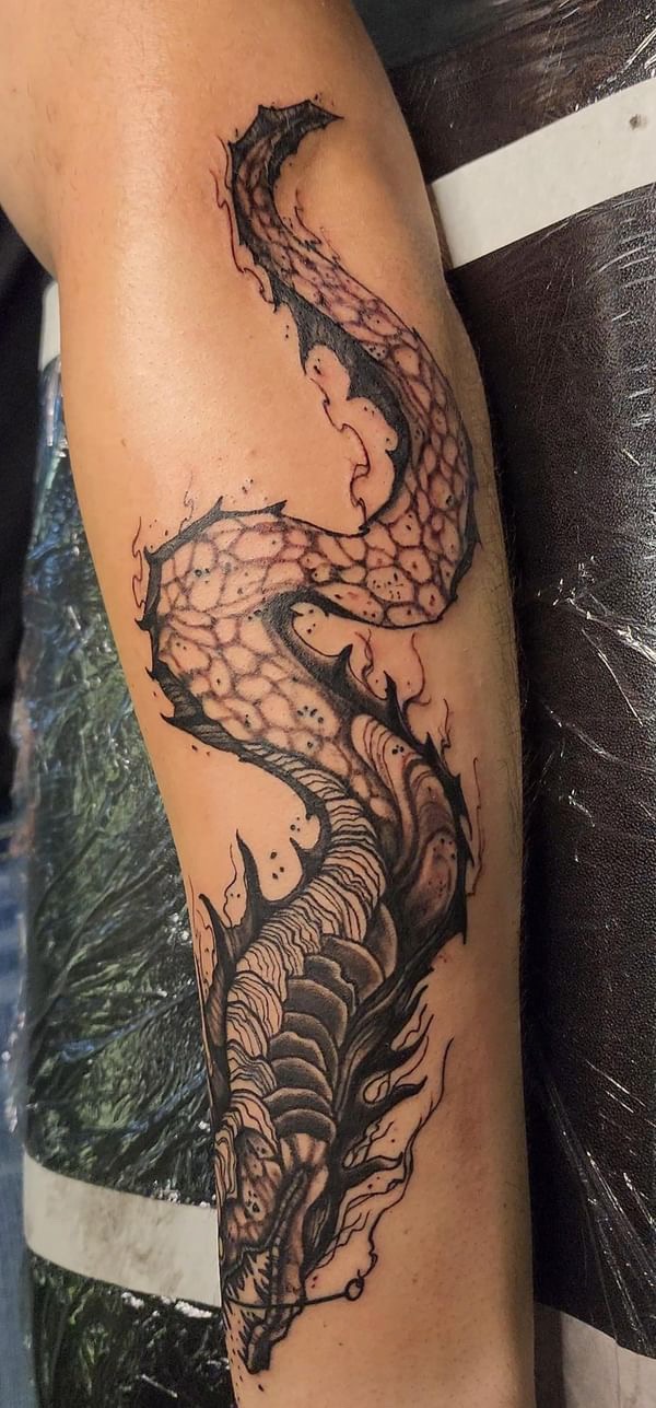 Black and grey dragon sleeve tattoo, full view