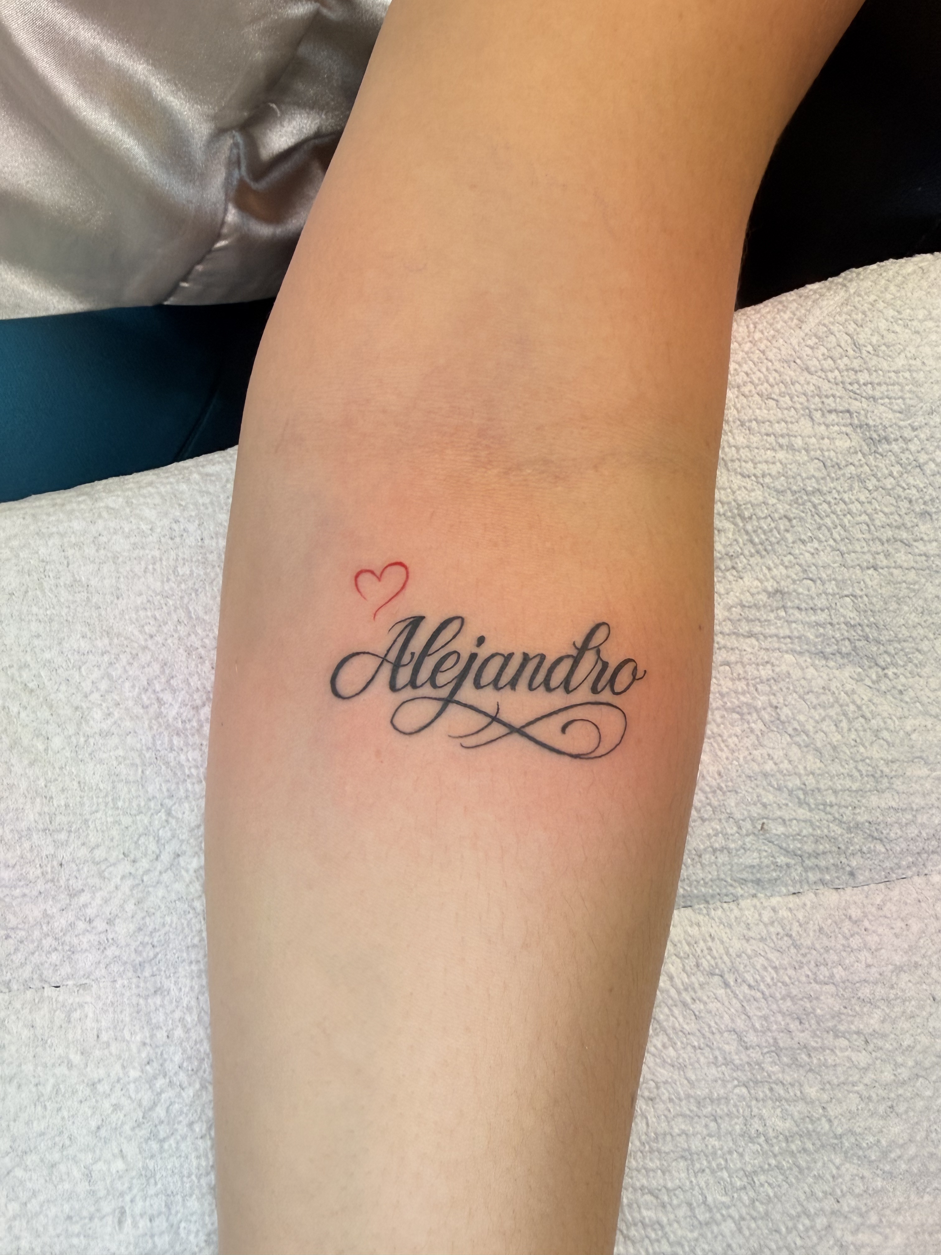 Fine line ornamental forearm tattoo