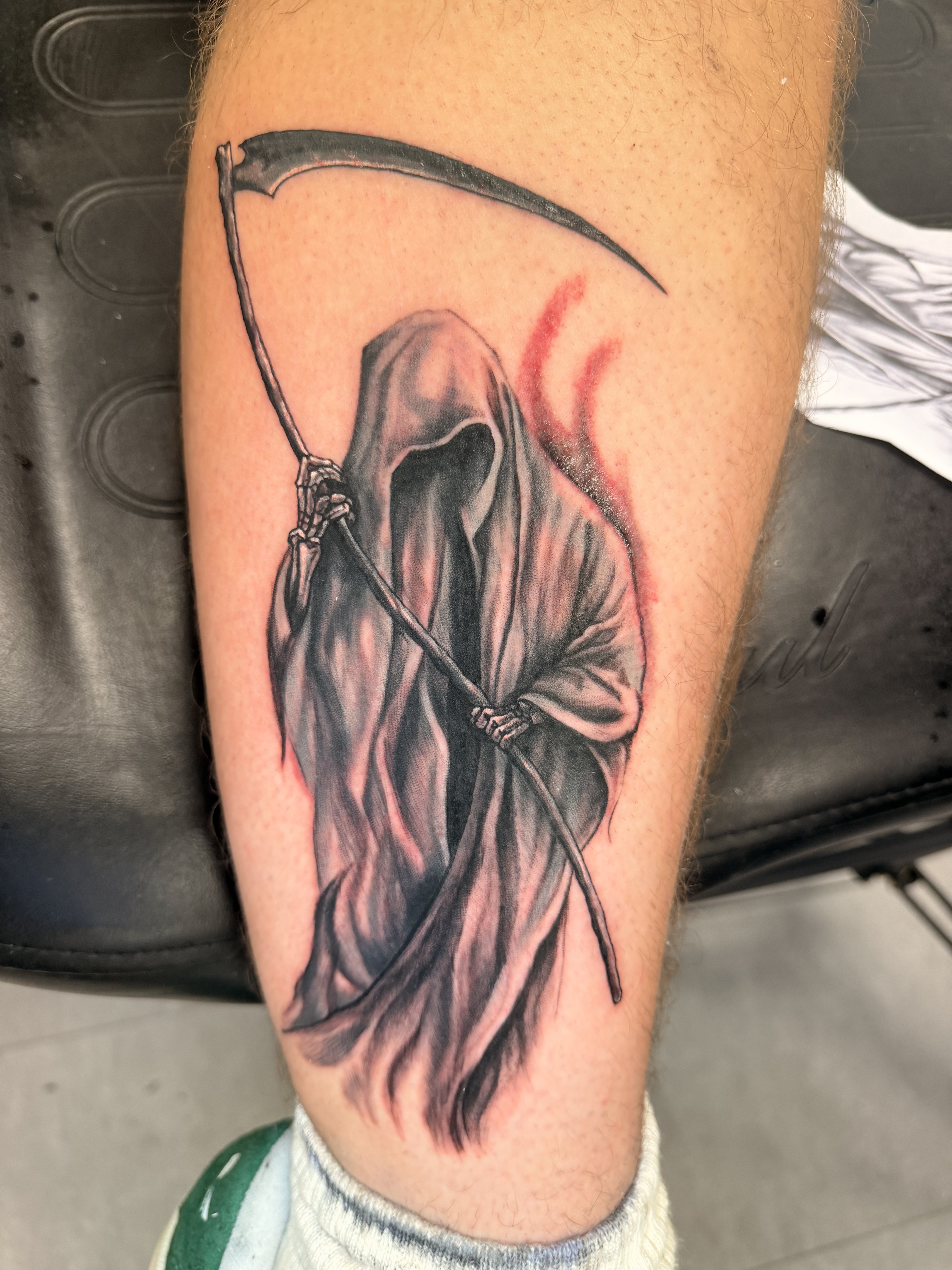 Large black and grey shoulder tattoo