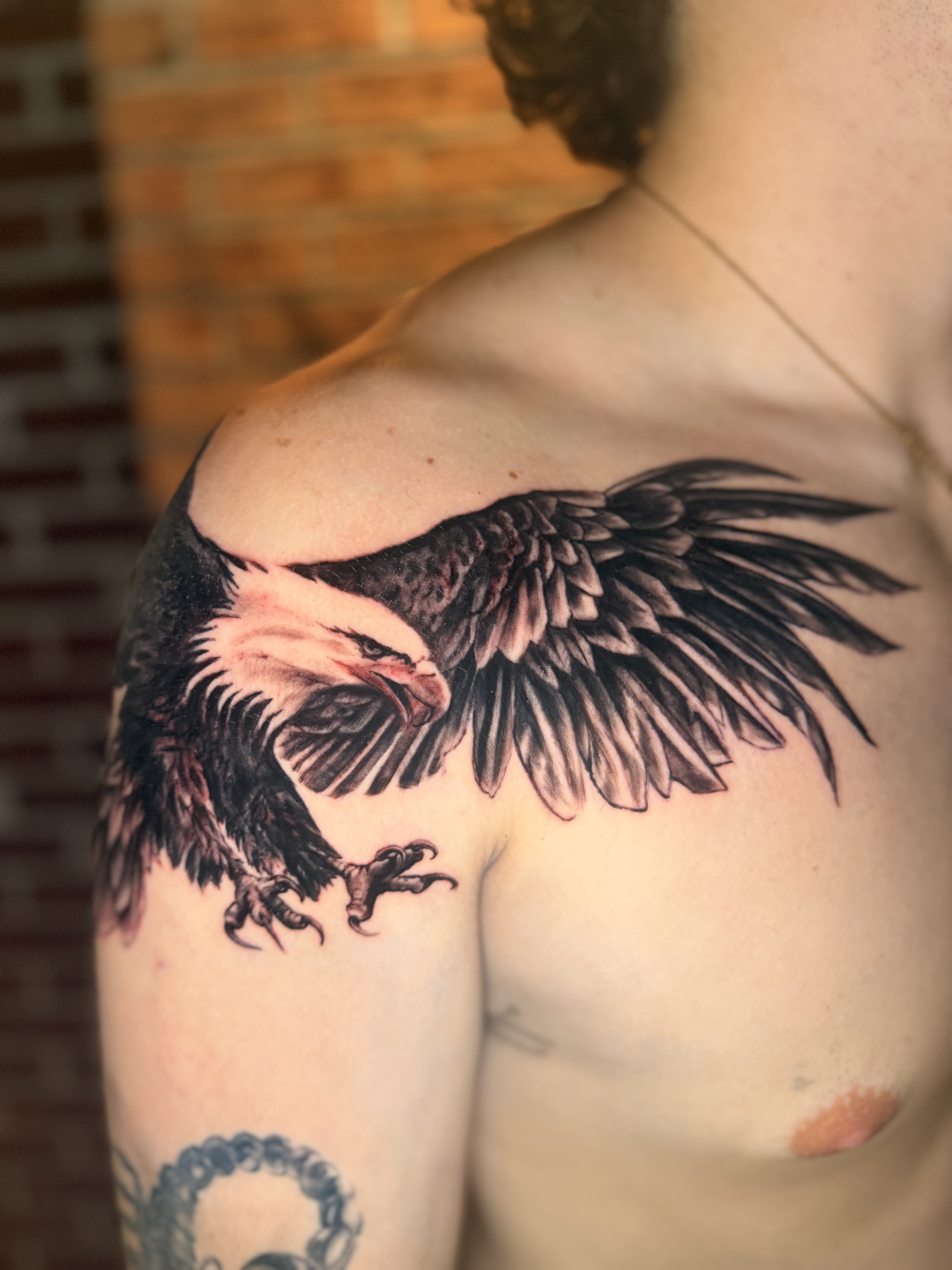 Fine line ornamental tattoo