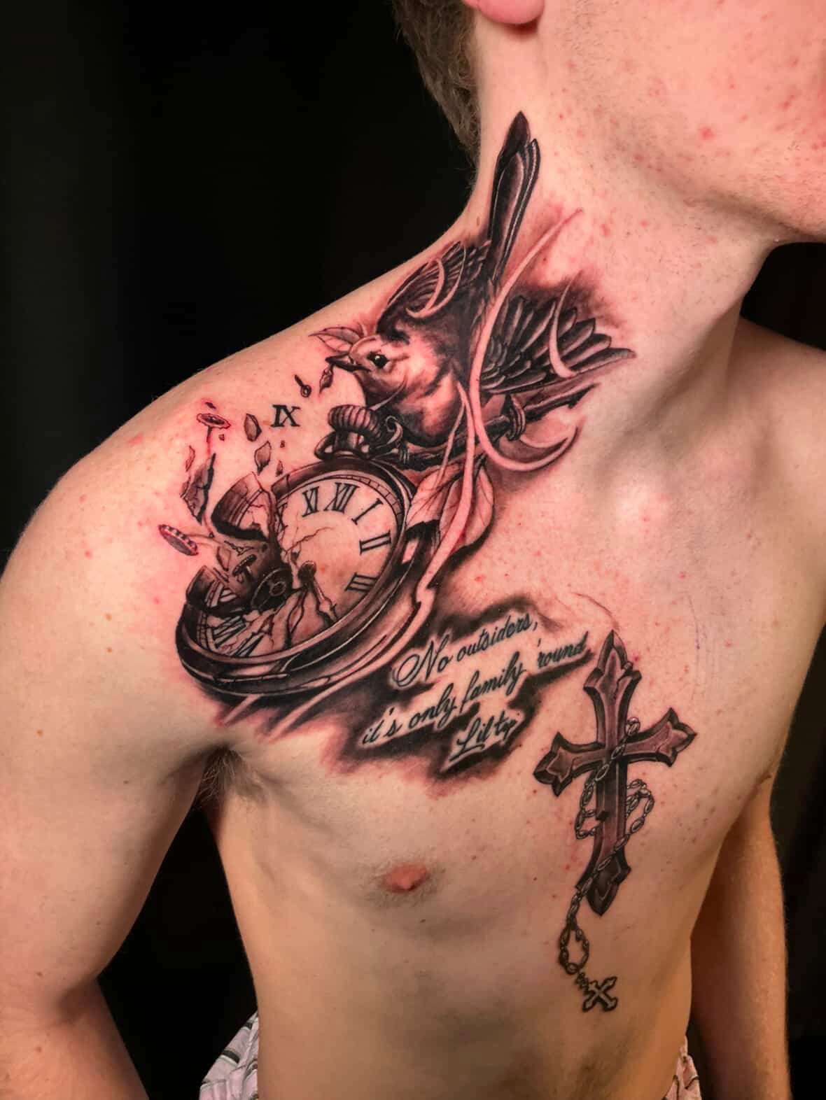Realistic shoulder tattoo with bird, shattered pocket watch, lettering and rosary cross