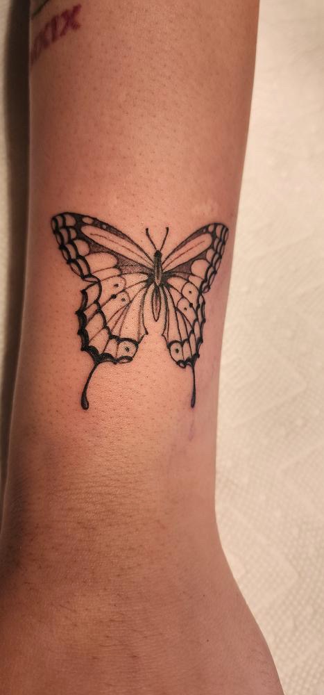 Fine line butterfly tattoo