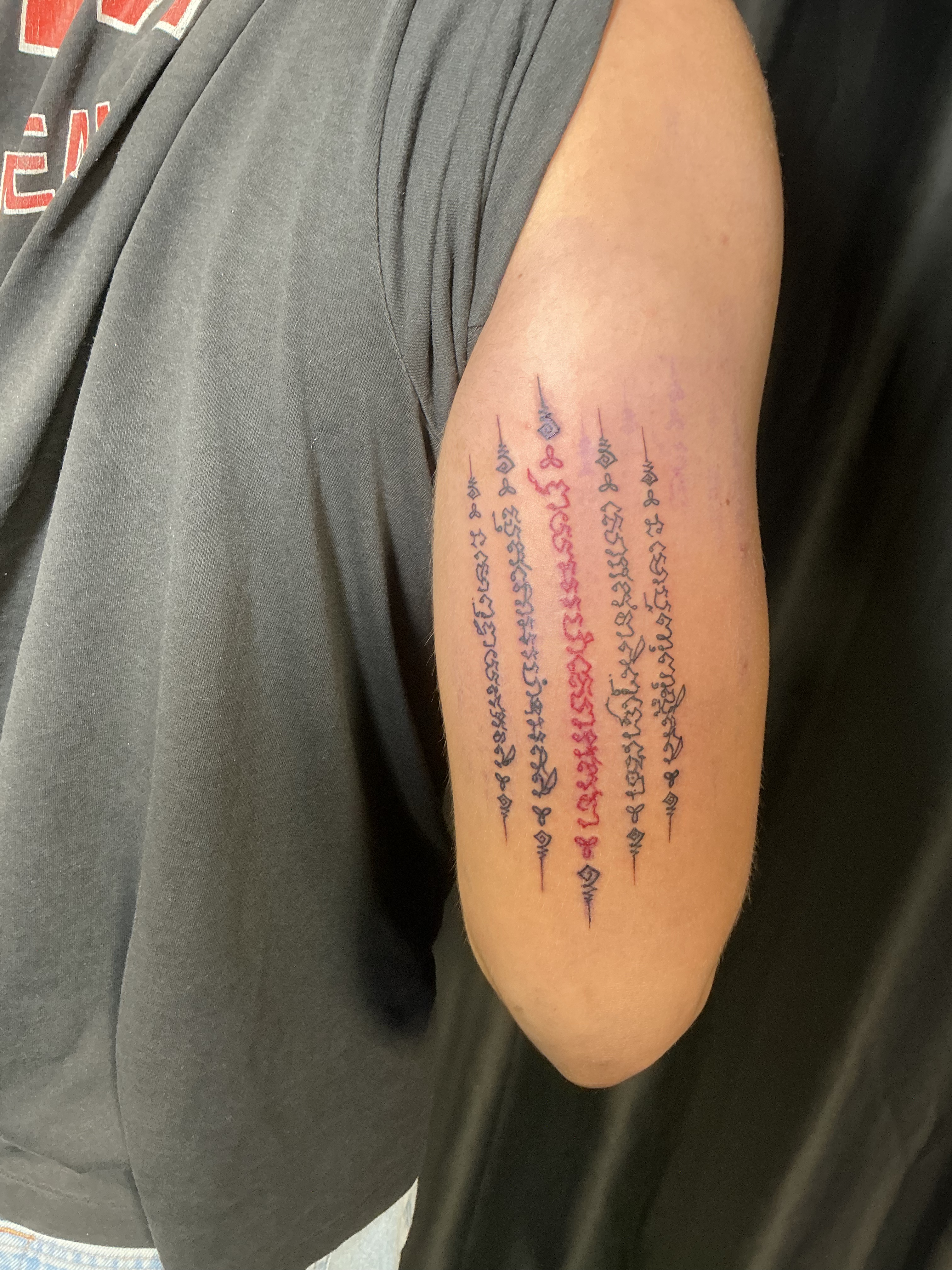 Fine line lettering forearm tattoo
