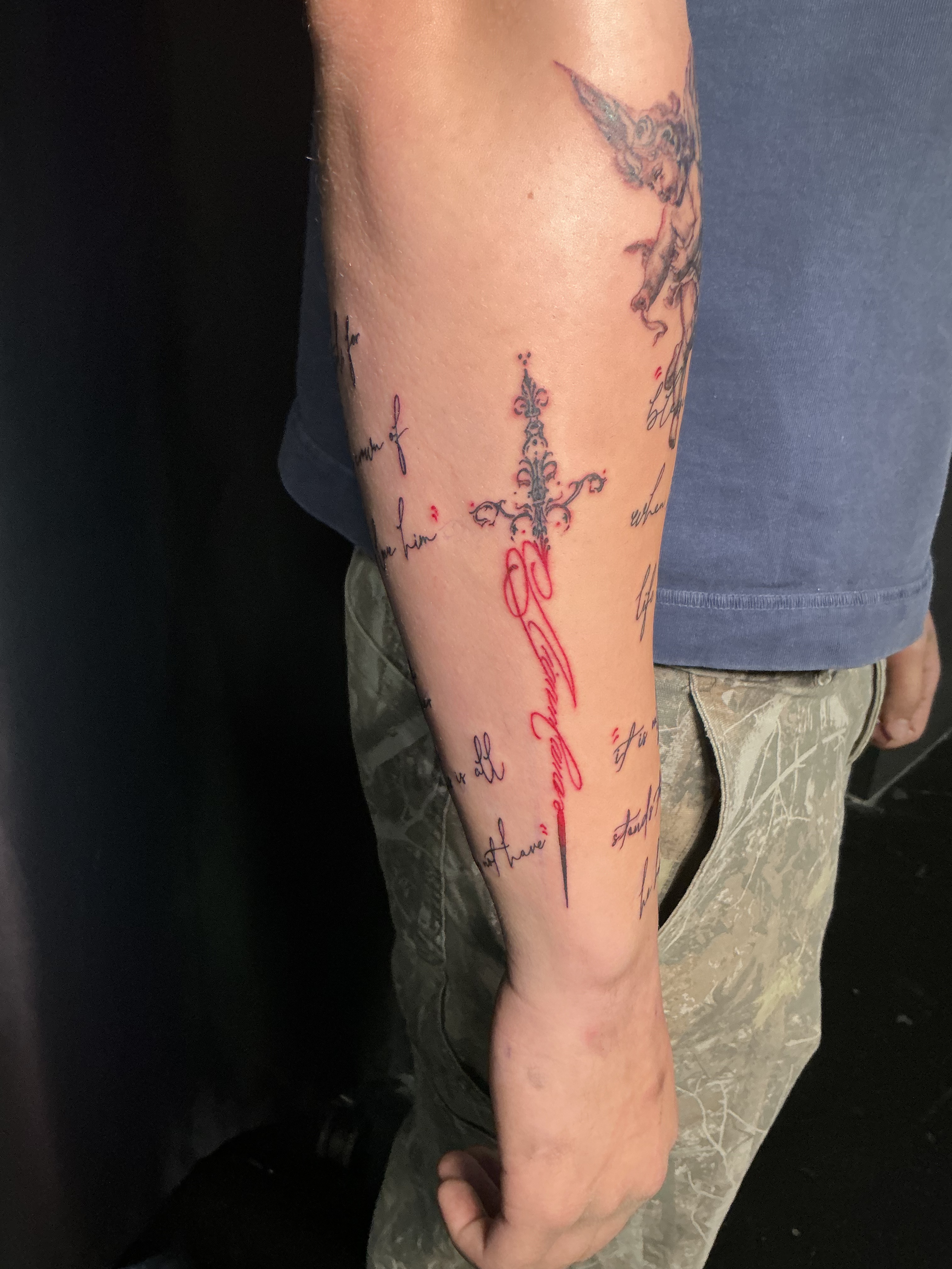Fine line script forearm tattoo