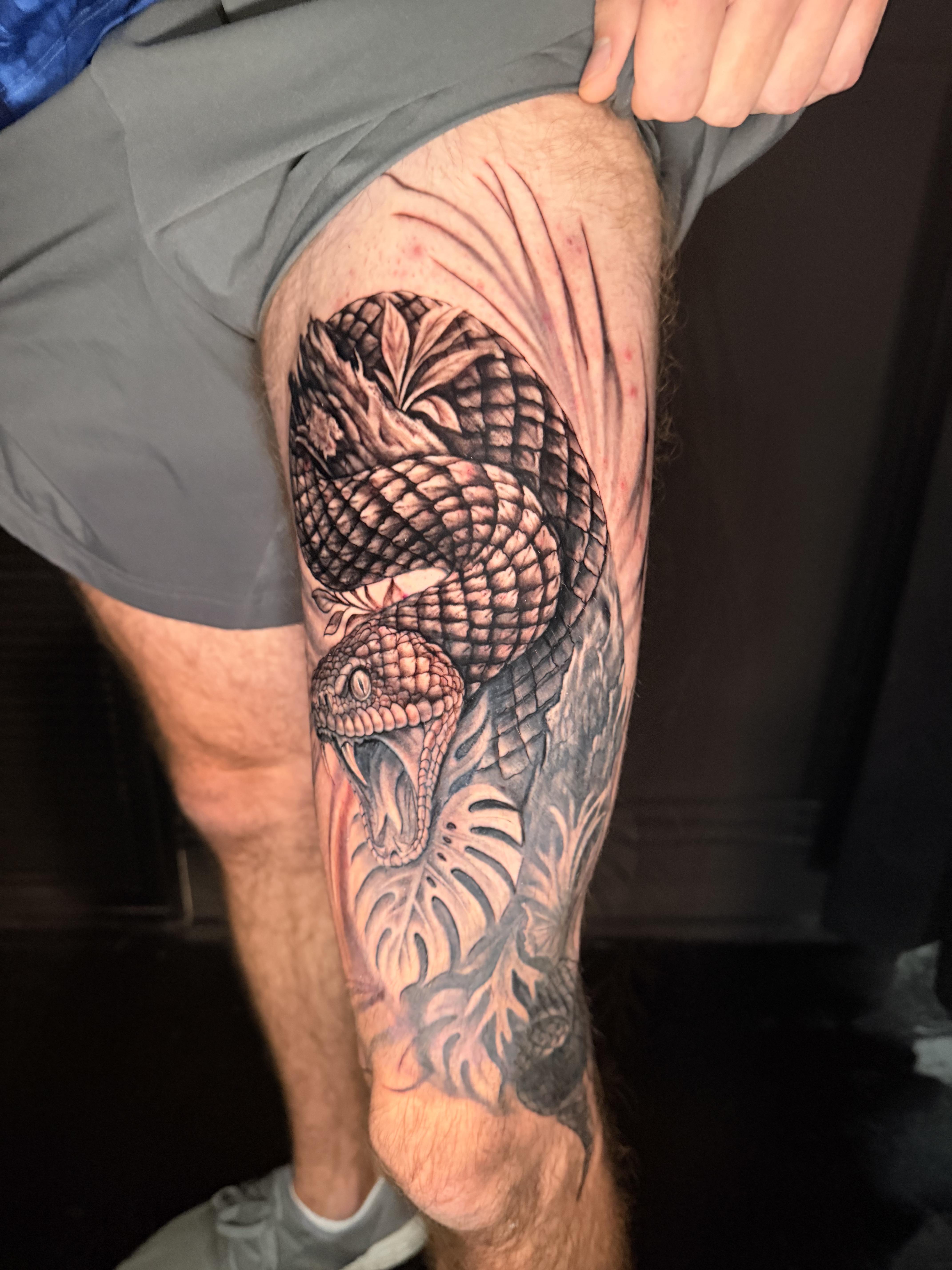 Large black and grey leg tattoo