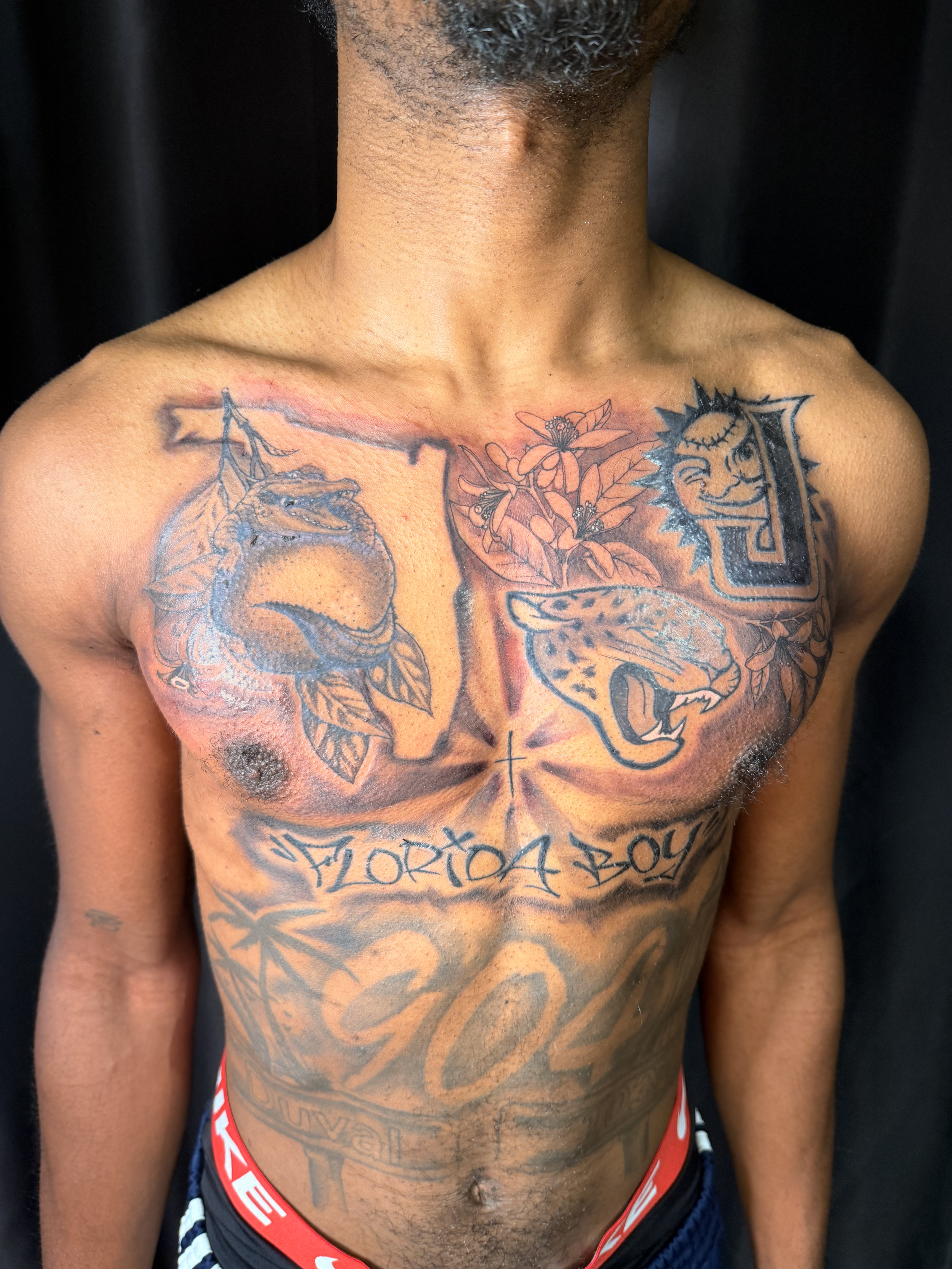Large black and grey back tattoo