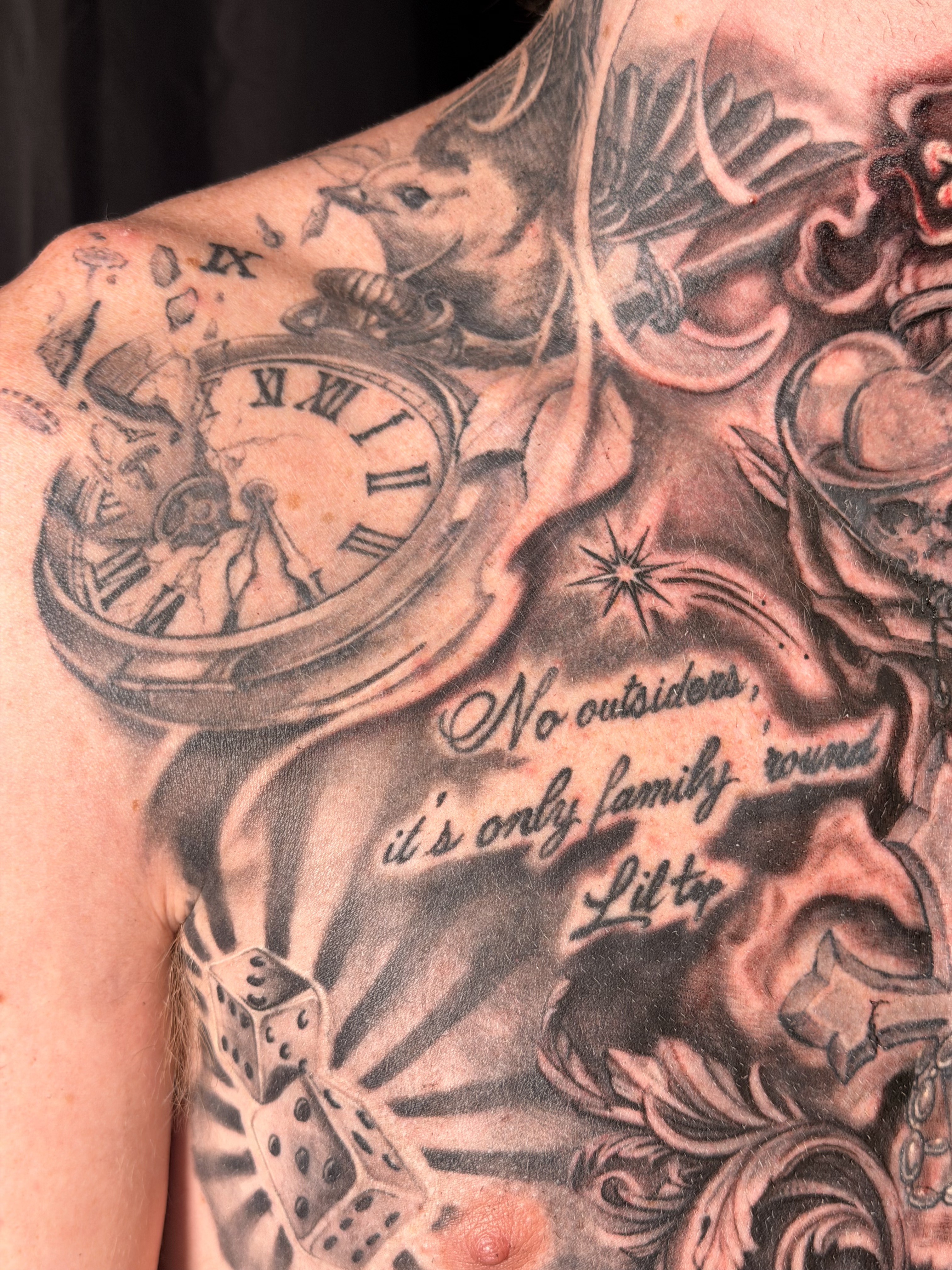 Black and grey forearm tattoo