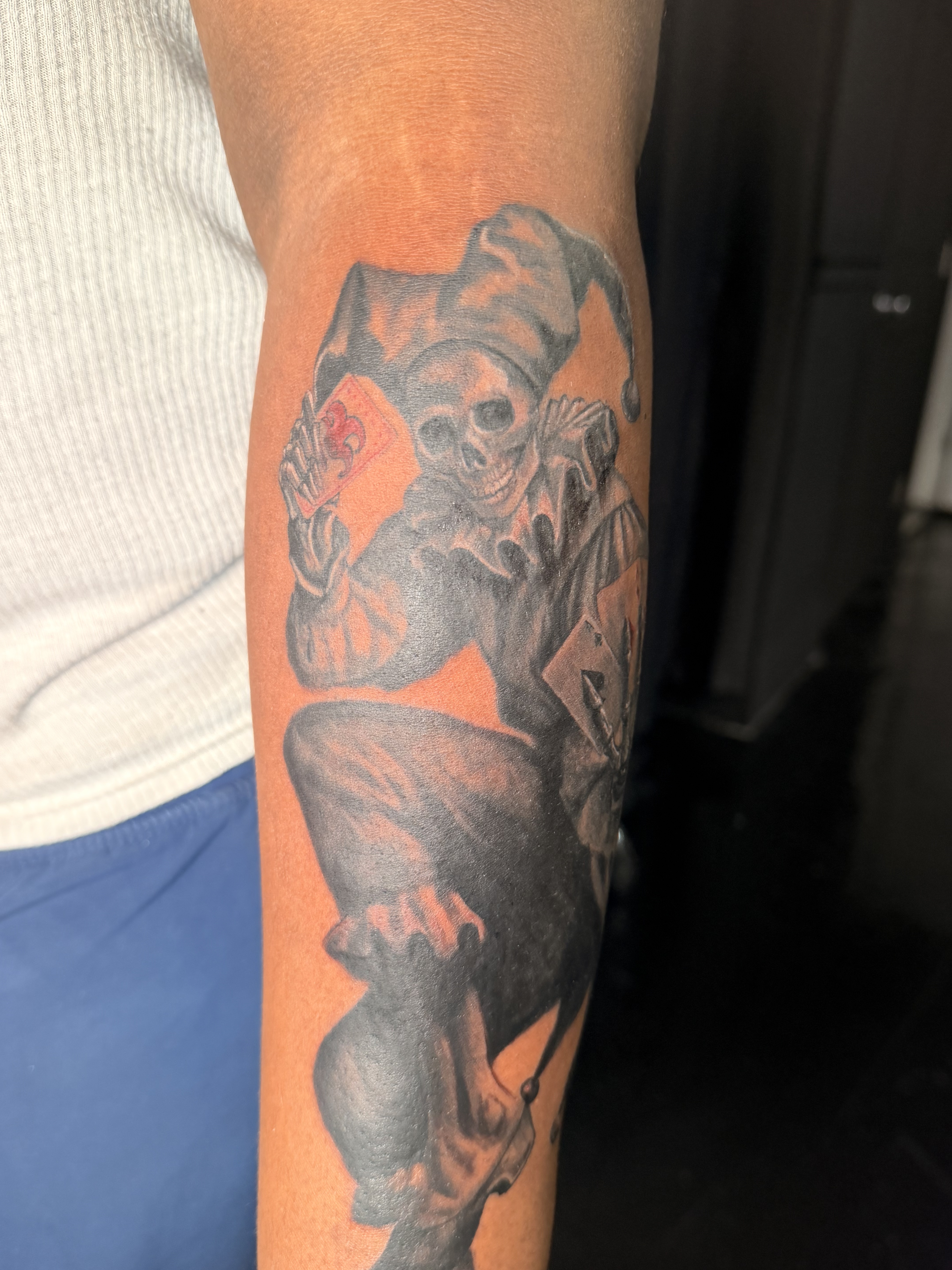 Black and grey forearm portrait tattoo