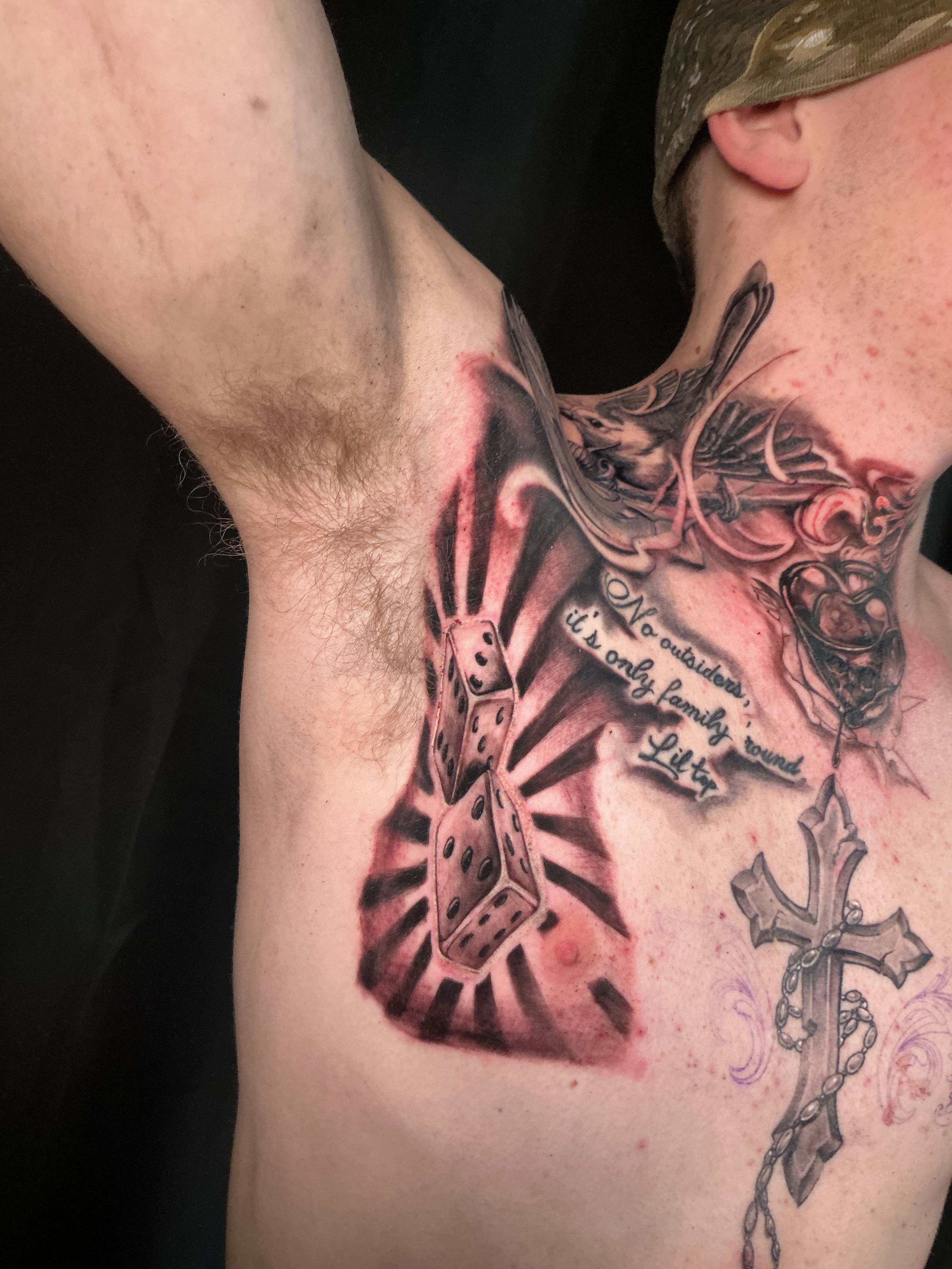 Large black and grey chest and shoulder tattoo
