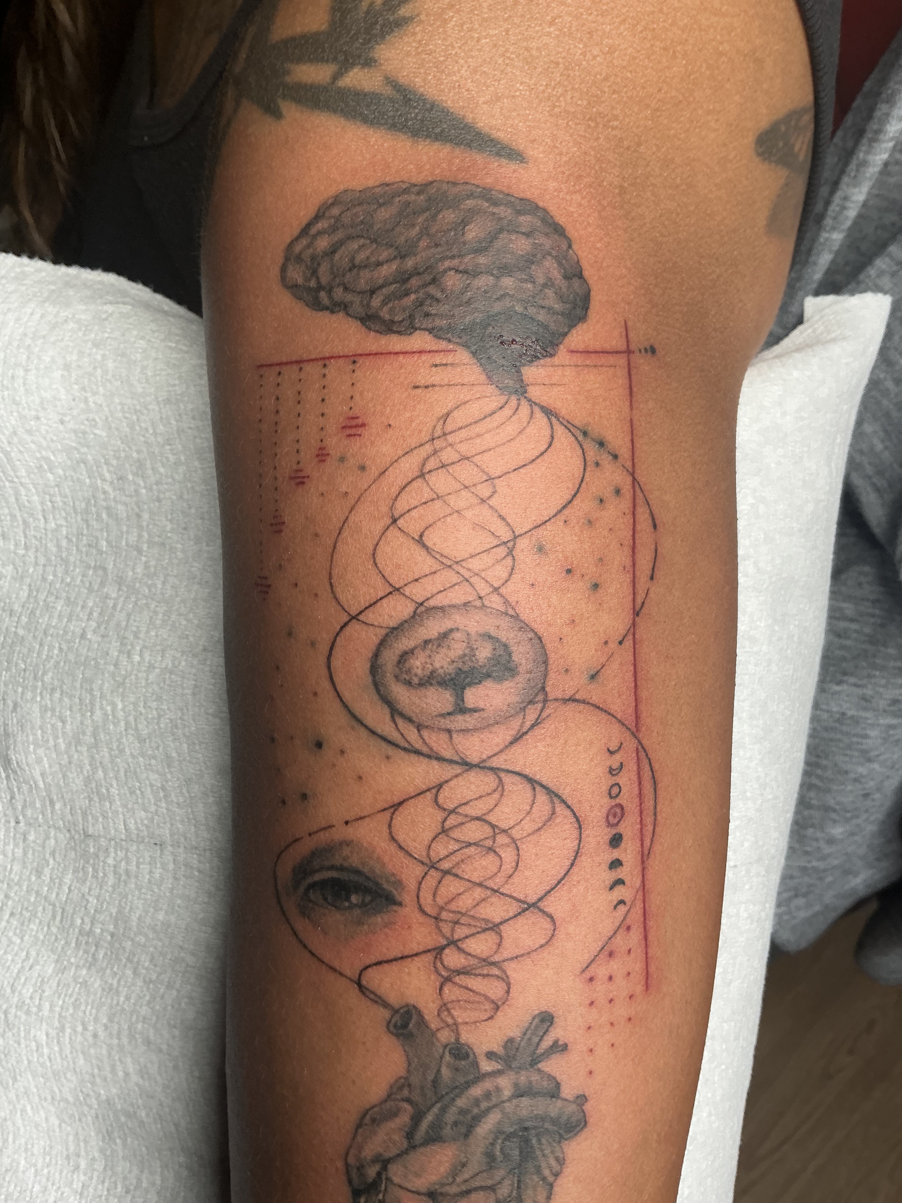 Large black and grey skull leg tattoo