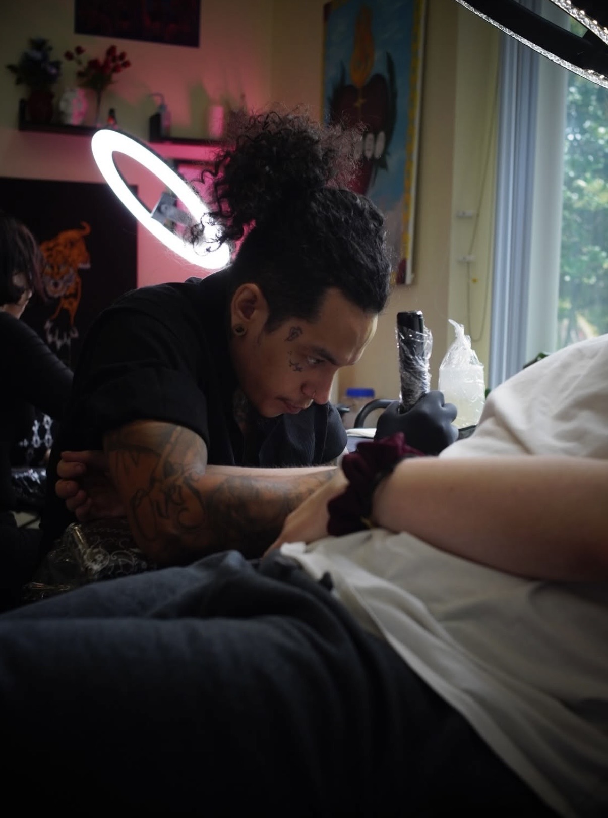 Fabian Gardeazabal tattooing a client at Hushtown Tattoos, Jacksonville