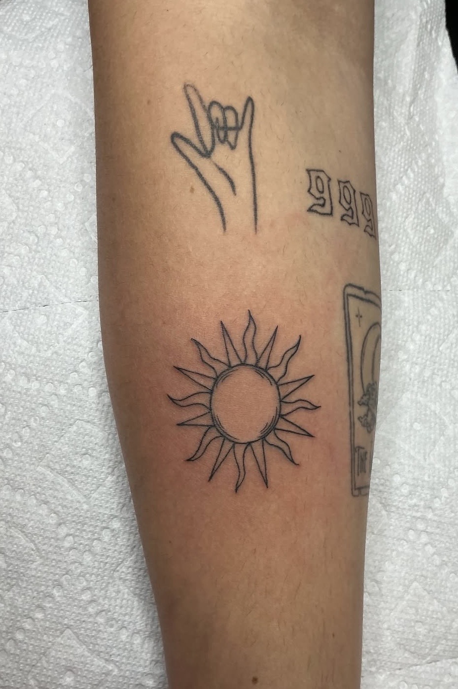 Fine line sun forearm tattoo by Fabian Gardeazabal at Hushtown Tattoos, Jacksonville FL